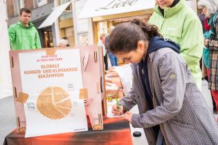 Greenpeace Activists Distribute Bread Made from Feed Wheat