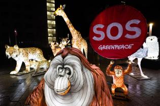 Protest with Luminous Animal Figures for Protecting Nature in front of UN Building in Bonn